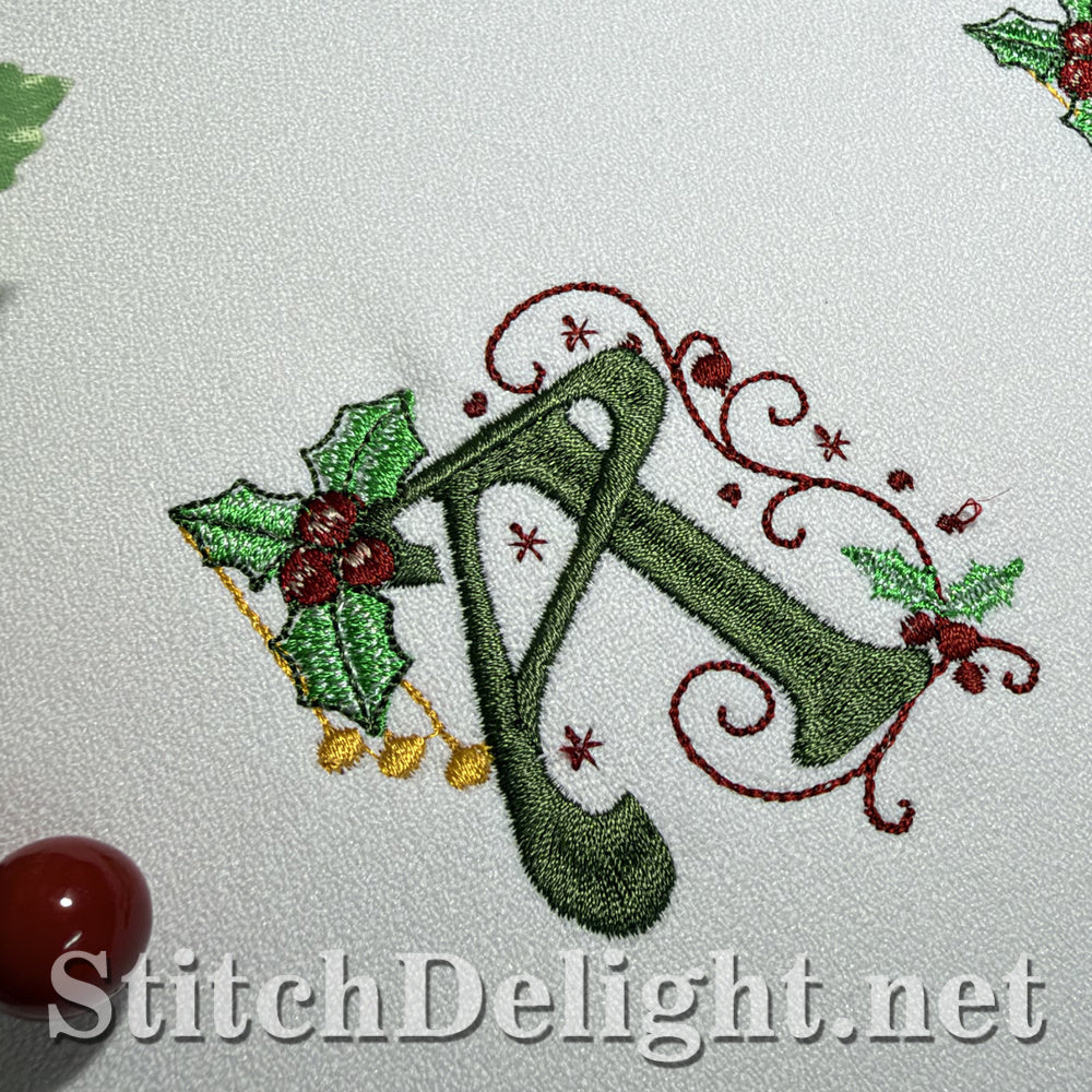 Close-up of Holly Noel monogram letter A in green satin stitch