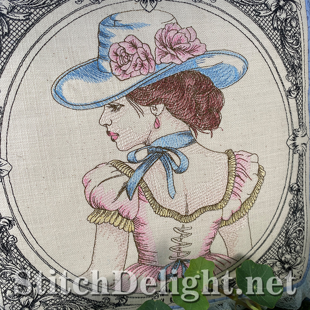Embroidery of a woman wearing a decorative hat with flowers, framed by intricate patterns.