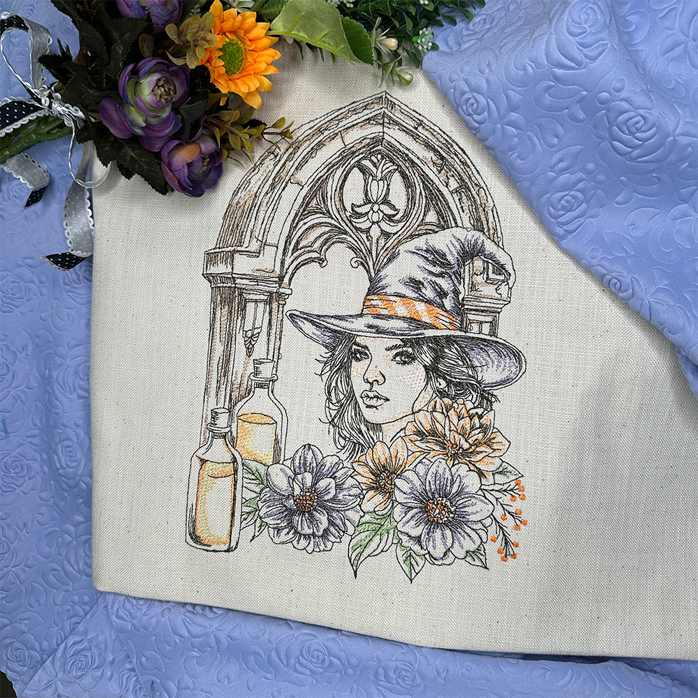 Embroidered design of a woman with flowers and bottles on fabric with a floral arrangement.