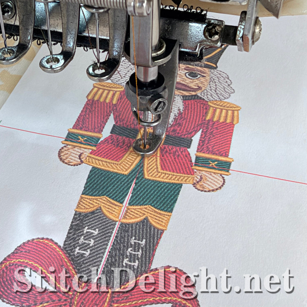 The nutcracker stitching out on fabric floated on the hooped stabilizer