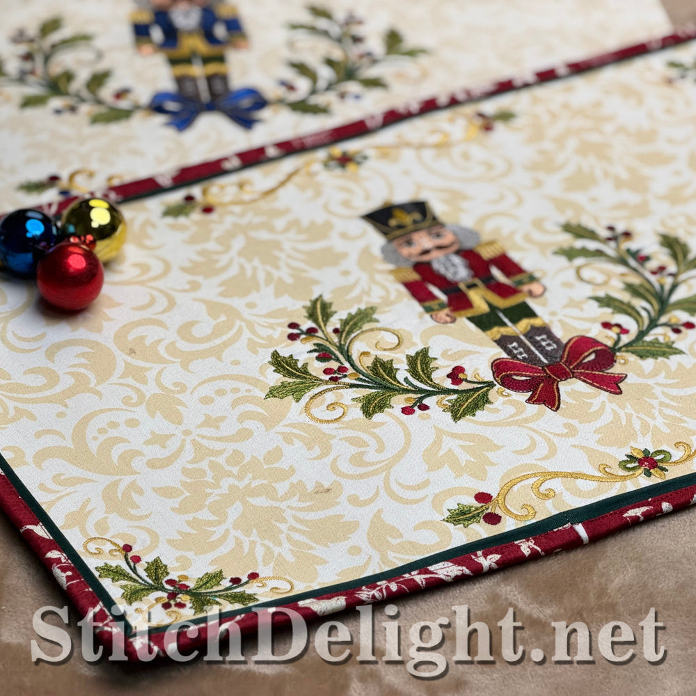 The red nutcracker placemat on a table with Christmas baubles