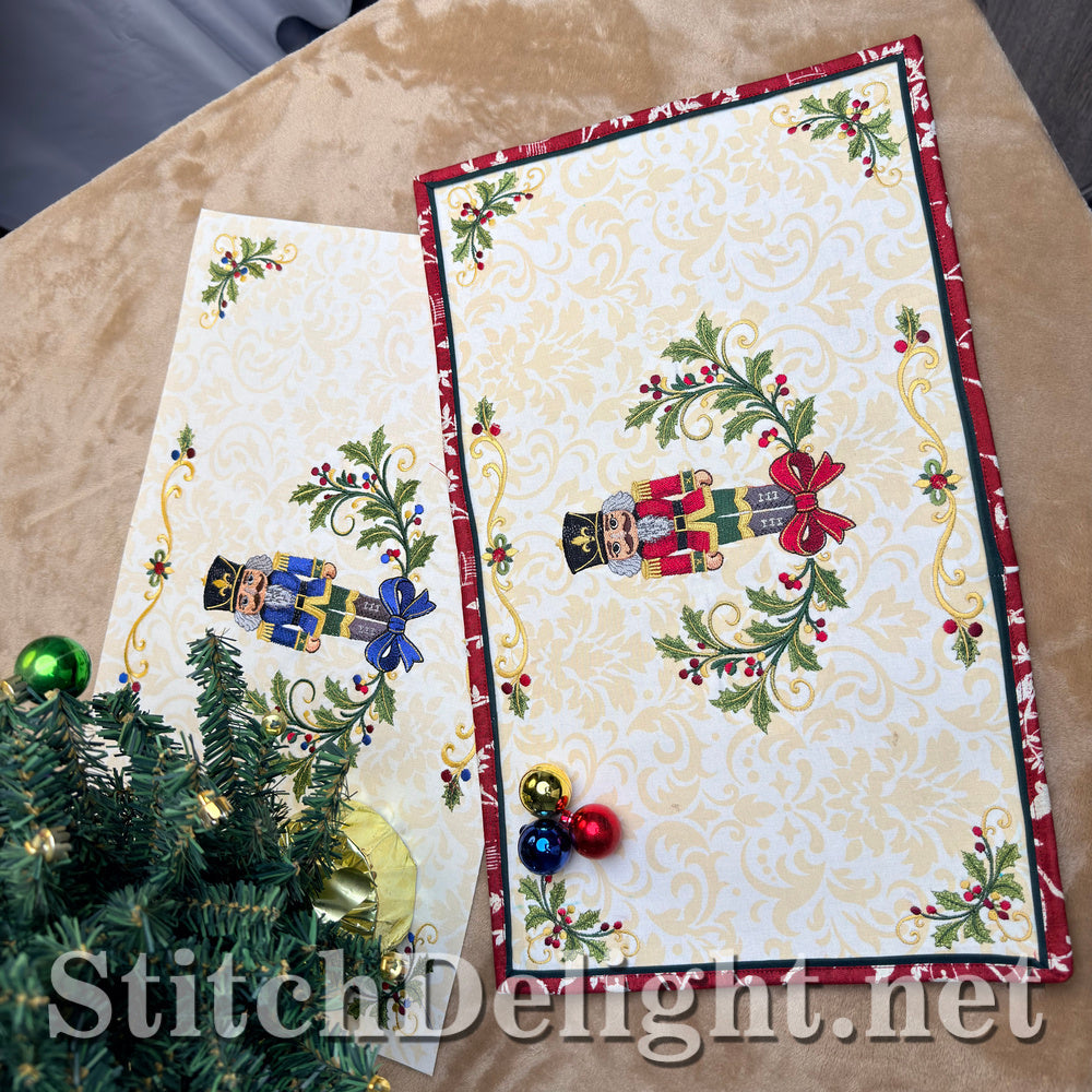 The red and blue nutcracker placemats on a table with a small Christmas tree and baubles
