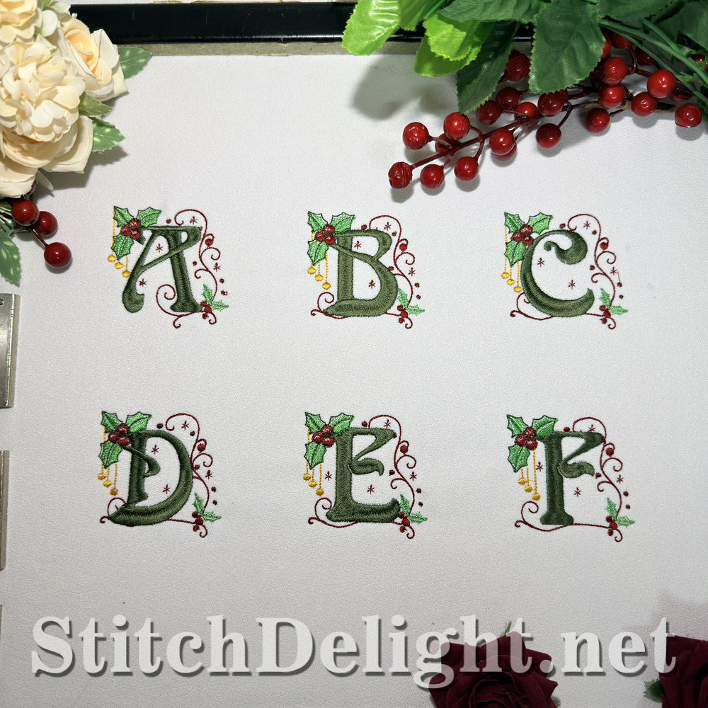 Holly Noel embroidery font letters A to F stitched on white fabric