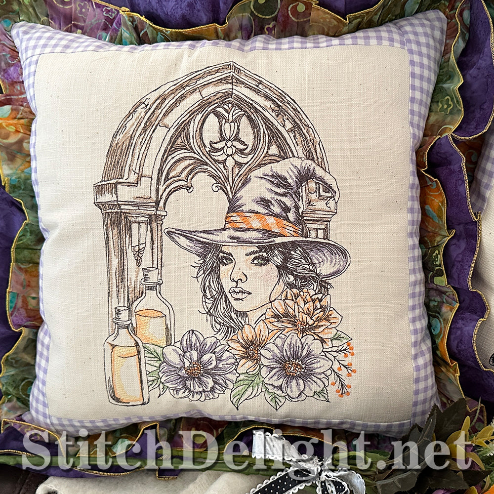 Decorative pillow with a gothic design featuring a woman in a hat and flowers, brand 'Stitch Delight' visible.