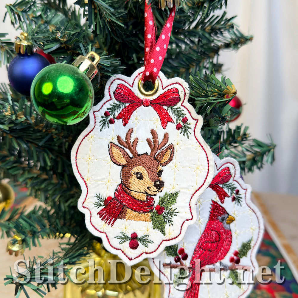 Deer Christmas tag with a red bow and holly in the foreground, with the matching cardinal tag partly visible behind it